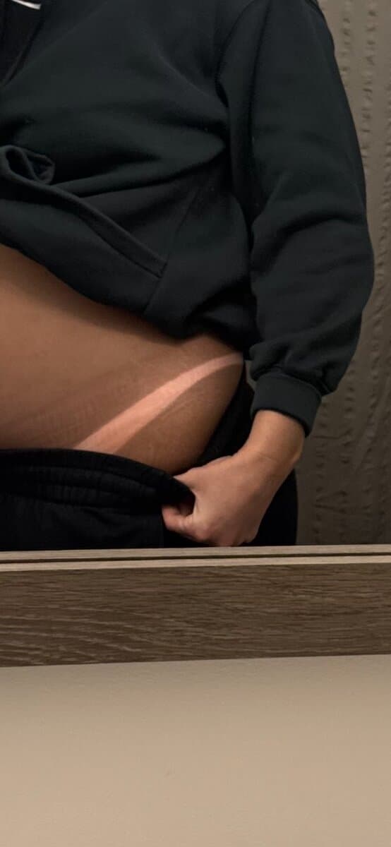 Spray tan results showing even, natural-looking tan